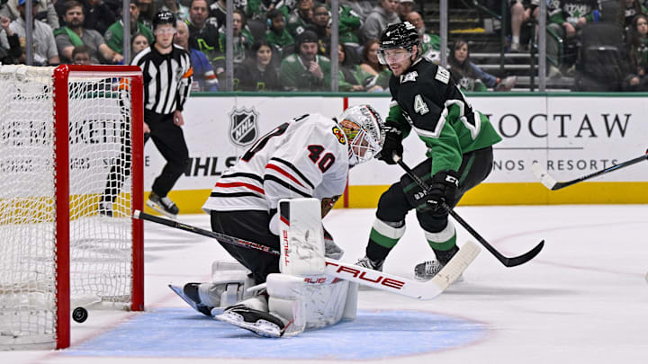 Mar 8, 2026; Dallas, Texas, USA; Dallas Stars defenseman Miro Heiskanen (4) scores the game-winning goal against Chicago Blackhawks goaltender Arvid Soderblom (40) during the overtime period at the American Airlines Center. Mandatory Credit: Jerome Miron-Imagn Images