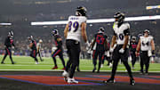 Dec 25, 2024; Houston, Texas, USA; Baltimore Ravens tight end Isaiah Likely (80) celebrates tight end Mark Andrews (89) touchdown reception against the Houston Texans in the second half at NRG Stadium. Mandatory Credit: Thomas Shea-Imagn Images