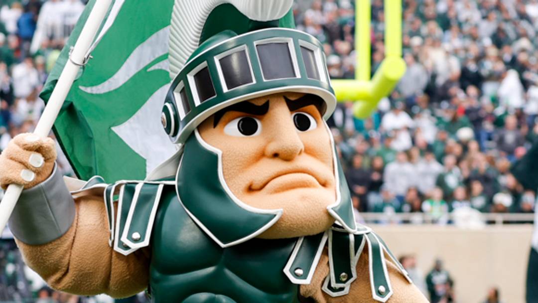 Michigan State mascot Sparty carries a flag during the Spartans' game against UCLA on Oct. 11, 2025.