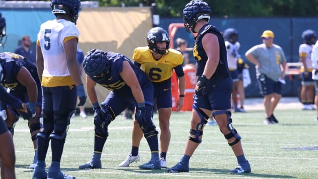 West Virginia University quarterback Garrett Greene barking out the play call during fall camp (2024).