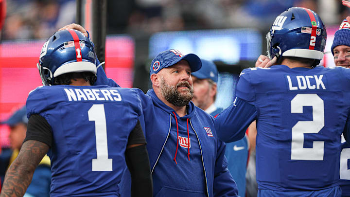Dec 29, 2024; East Rutherford, New Jersey, USA; New York Giants head coach Brian Daboll congratulates wide receiver Malik Nabers (1) and quarterback Drew Lock (2) after a touchdown during the second half against the Indianapolis Colts at MetLife Stadium. Mandatory Credit: Vincent Carchietta-Imagn Images Dec 29, 2024; East Rutherford, New Jersey, USA; New York Giants head coach Brian Daboll congratulates wide receiver Malik Nabers (1) and quarterback Drew Lock (2) after a touchdown during the second half against the Indianapolis Colts at MetLife Stadium. Mandatory Credit: Vincent Carchietta-Imagn Images