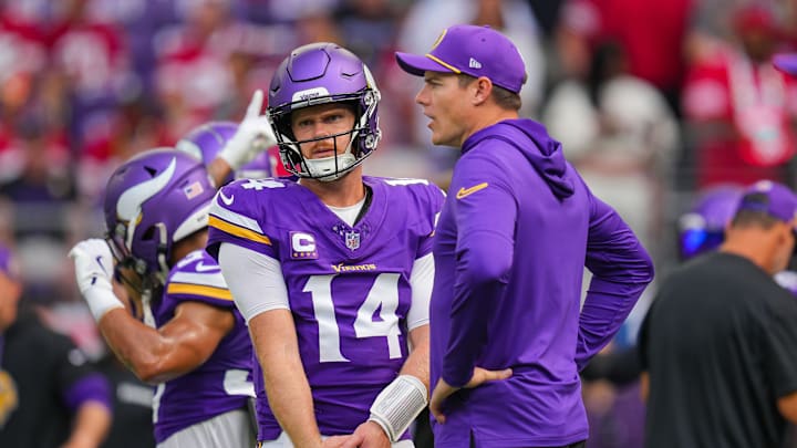 Darnold and O'Connell talk before the game against the San Francisco 49ers at U.S. Bank Stadium.