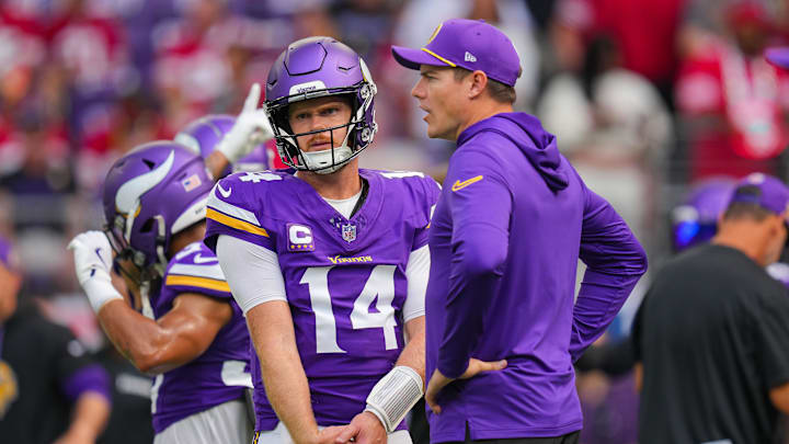 Sep 15, 2024; Minneapolis, Minnesota, USA; Minnesota Vikings quarterback Sam Darnold (14) and head coach Kevin O'Connell talk before the game against the San Francisco 49ers at U.S. Bank Stadium. Mandatory Credit: Brad Rempel-Imagn Images