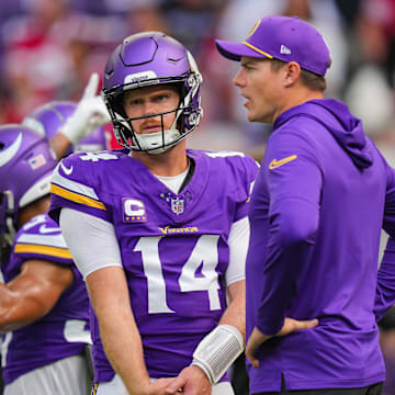 Sep 15, 2024; Minneapolis, Minnesota, USA; Minnesota Vikings quarterback Sam Darnold (14) and head coach Kevin O'Connell talk before the game against the San Francisco 49ers at U.S. Bank Stadium.