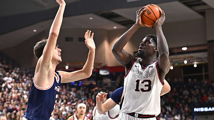 Feb 15, 2025; Spokane, Washington, USA; Gonzaga Bulldogs forward Graham Ike (13) shoots the ball against Pepperdine Waves forward Danilo Dozic (35) in the first half at McCarthey Athletic Center. Mandatory Credit: James Snook-Imagn Images Feb 15, 2025; Spokane, Washington, USA; Gonzaga Bulldogs forward Graham Ike (13) shoots the ball against Pepperdine Waves forward Danilo Dozic (35) in the first half at McCarthey Athletic Center. Mandatory Credit: James Snook-Imagn Images
