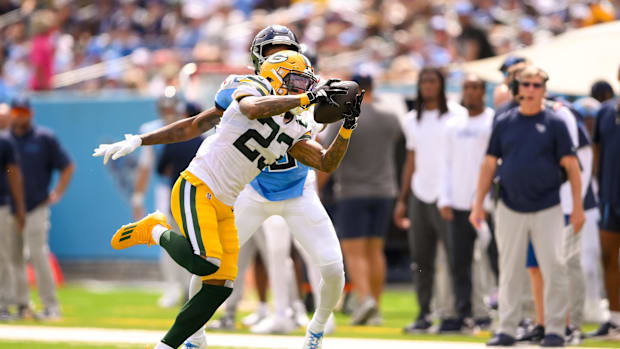 Green Bay Packers cornerback Jaire Alexander (23) intercepts a pass and returns it for a touchdown at the Titans.