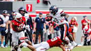 Sep 6, 2025; Raleigh, North Carolina, USA; North Carolina State Wolfpack safety Brody Barnhardt (29) sacks Virginia Cavaliers running back J'Mari Taylor (3) during the second half of the game at Carter-Finley Stadium. Mandatory Credit: Jaylynn Nash-Imagn Images