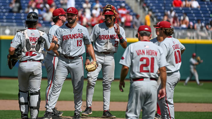Jun 18, 2022; Omaha, NE, USA;  Arkansas Razorbacks head coach Dave Van Horn walks to the mound to replace starting pitcher Connor Noland (13) in the eighth inning against the Stanford Cardinal at Charles Schwab Field. Mandatory Credit: Steven Branscombe-USA TODAY Sports