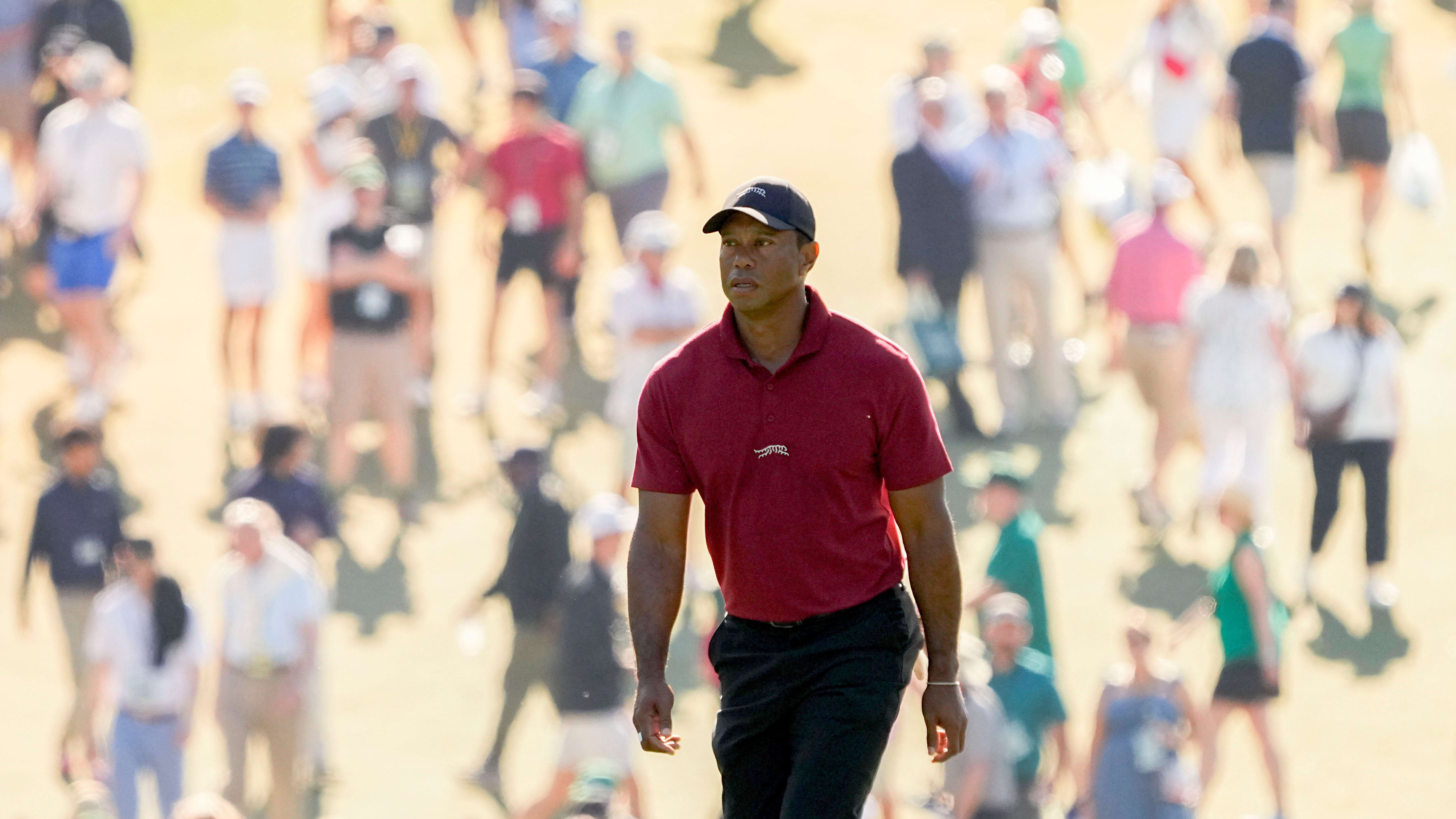 Tiger Woods walks up the No. 1 fairway during the final round of the 2024 Masters.