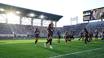 Washington Spirit players warm up before a game at Audi Field.