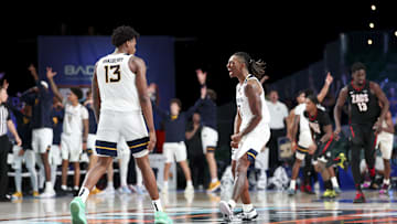 Nov 27, 2024; Paradise Island, Bahamas, BHS; West Virginia Mountaineers guard Javon Small (7) celebrates with West Virginia Mountaineers forward Amani Hansberry (13) during the second half against the Gonzaga Bulldogs at the Atlantis Resort.  Mandatory Credit: Kevin Jairaj-Imagn Images