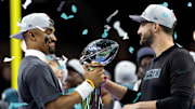 Feb 9, 2025; New Orleans, LA, USA; Philadelphia Eagles quarterback Jalen Hurts (left) and head coach Nick Sirianni celebrate with the Vince Lombardi Trophy after defeating the Kansas City Chiefs during Super Bowl LIX at Ceasars Superdome. Mandatory Credit: Mark J. Rebilas-Imagn Images