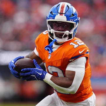 Oct 26, 2025; Denver, Colorado, USA; Denver Broncos running back RJ Harvey (12) runs against the Dallas Cowboys in the second half at Empower Field at Mile High. 