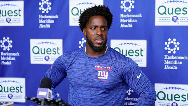 New York Giants assistant general manager Brandon Brown talks to reporters after the first day of mandatory minicamp.
