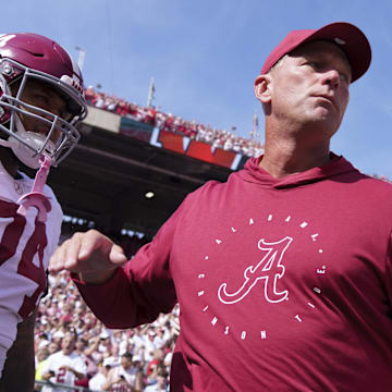 Sep 14, 2024; Madison, Wisconsin, USA;  Alabama Crimson Tide head coach Kalen DeBoer greets offensive lineman Kadyn Proctor (74) prior to the game against the Wisconsin Badgers at Camp Randall Stadium. 