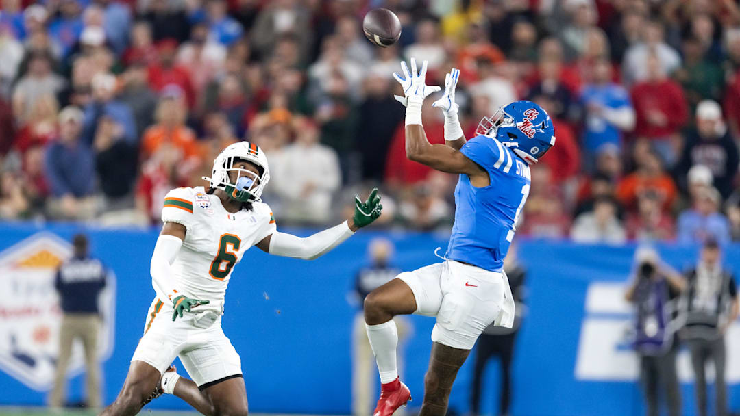 Jan 8, 2026; Glendale, AZ, USA; Mississippi Rebels wide receiver De'Zhaun Stribling (1) against Miami Hurricanes defensive back Xavier Lucas (6) during the 2026 Fiesta Bowl and semifinal game of the College Football Playoff at State Farm Stadium. Mandatory Credit: Mark J. Rebilas-Imagn Images
