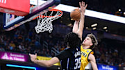 Indiana Pacers forward Johnny Furphy dunks the ball over Orlando Magic center Goga Bitadze during the second quarter at Gainbridge Fieldhouse. 