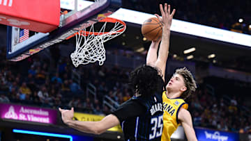 Indiana Pacers forward Johnny Furphy dunks the ball over Orlando Magic center Goga Bitadze during the second quarter at Gainbridge Fieldhouse. 