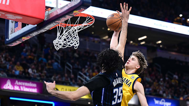 Indiana Pacers forward Johnny Furphy dunks the ball over Orlando Magic center Goga Bitadze during the second quarter at Gainbridge Fieldhouse. 