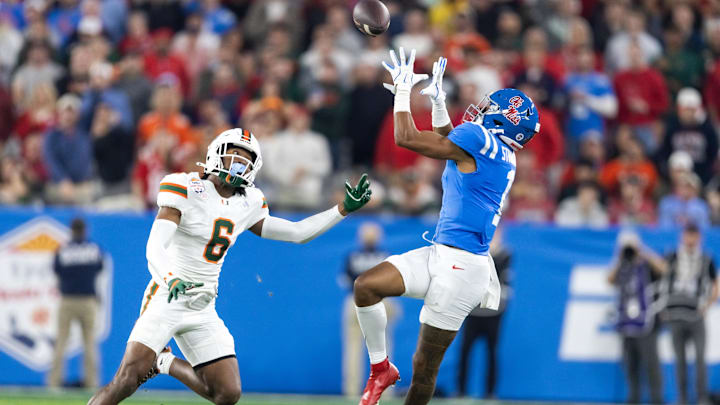 Jan 8, 2026; Glendale, AZ, USA; Mississippi Rebels wide receiver De'Zhaun Stribling (1) against Miami Hurricanes defensive back Xavier Lucas (6) during the 2026 Fiesta Bowl and semifinal game of the College Football Playoff at State Farm Stadium. Mandatory Credit: Mark J. Rebilas-Imagn Images