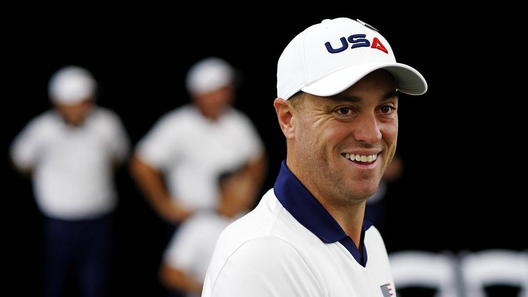 Sep 25, 2025; Bethpage, New York, USA; Justin Thomas laughs during the team portrait before a practice round of the Ryder Cup golf tournament at Bethpage Black. Mandatory Credit: Peter Casey-Imagn Images