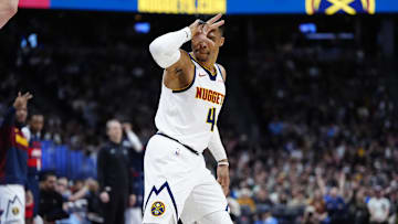 Mar 15, 2025; Denver, Colorado, USA; Denver Nuggets guard Russell Westbrook (4) celebrates a successful three-point score in the first quarter against the Washington Wizards at Ball Arena. Mandatory Credit: Ron Chenoy-Imagn Images