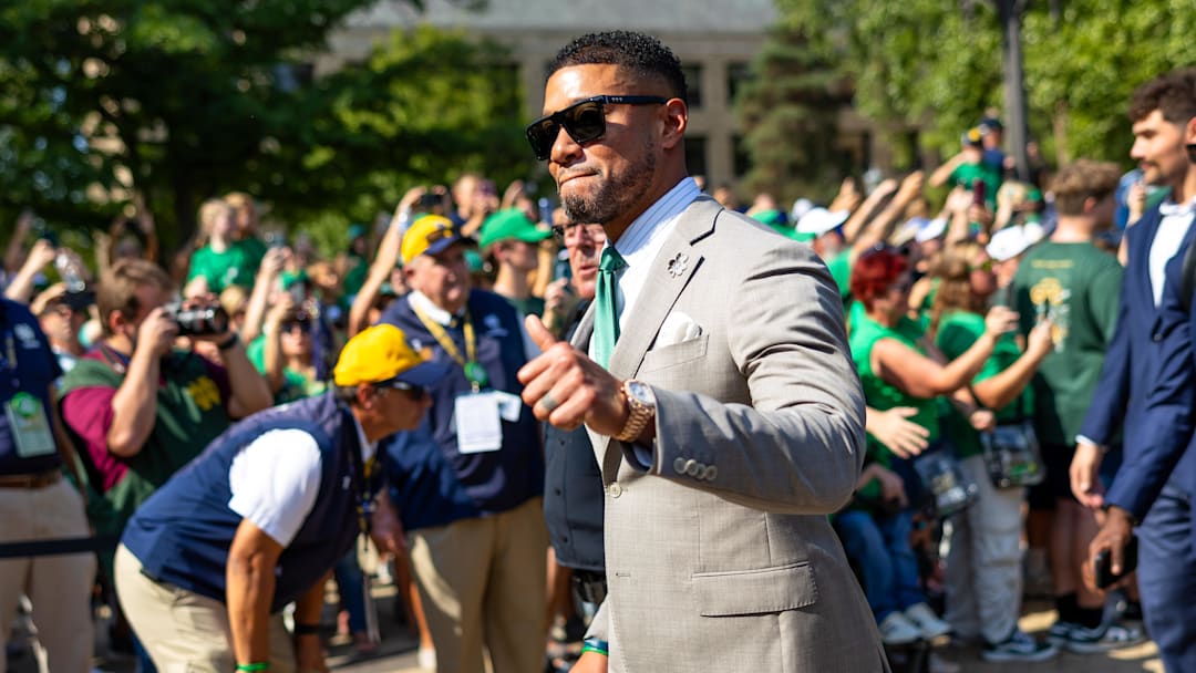 Oct 4, 2025; South Bend, Indiana, USA; Notre Dame Fighting Irish head coach Marcus Freeman gives a thumbs up to fans while walking to the stadium before a game against the Boise State Broncos at Notre Dame Stadium. Mandatory Credit: Michael Caterina-Imagn Images Oct 4, 2025; South Bend, Indiana, USA; Notre Dame Fighting Irish head coach Marcus Freeman gives a thumbs up to fans while walking to the stadium before a game against the Boise State Broncos at Notre Dame Stadium. Mandatory Credit: Michael Caterina-Imagn Images