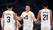 Apr 12, 2024; Los Angeles, California, USA;  Utah Jazz forward Kenneth Lofton Jr. (34) is greets guard Keyonte George (3) and forward Darius Bazley (21) during the second quarter against the Los Angeles Clippers at Crypto.com Arena. Mandatory Credit: Kiyoshi Mio-USA TODAY Sports