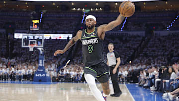 May 20, 2025; Oklahoma City, Oklahoma, USA; Minnesota Timberwolves guard Nickeil Alexander-Walker (9) saves a ball against the Oklahoma City Thunder in the second quarter during game one of the western conference finals for the 2025 NBA Playoffs at Paycom Center. Mandatory Credit: Alonzo Adams-Imagn Images