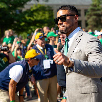 Oct 4, 2025; South Bend, Indiana, USA; Notre Dame Fighting Irish head coach Marcus Freeman gives a thumbs up to fans while walking to the stadium before a game against the Boise State Broncos at Notre Dame Stadium. Mandatory Credit: Michael Caterina-Imagn Images