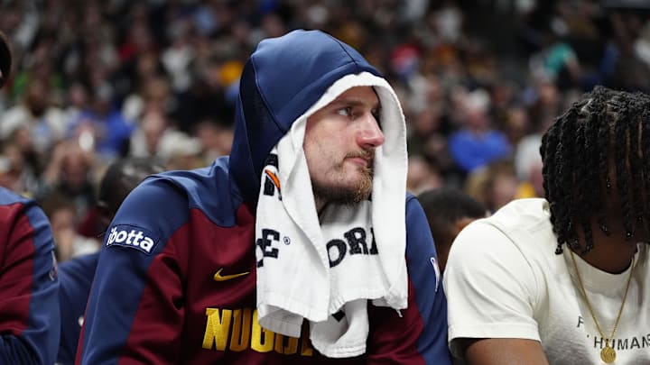 Jan 10, 2025; Denver, Colorado, USA; Denver Nuggets center Nikola Jokic (15) sits on the bench in the second quarter against the Brooklyn Nets at Ball Arena. Jan 10, 2025; Denver, Colorado, USA; Denver Nuggets center Nikola Jokic (15) sits on the bench in the second quarter against the Brooklyn Nets at Ball Arena.