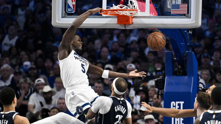 May 26, 2024; Dallas, Texas, USA; Minnesota Timberwolves guard Anthony Edwards (5) dunks the ball over Dallas Mavericks center Daniel Gafford (21) during game three of the western conference finals for the 2024 NBA playoffs at American Airlines Center. Mandatory Credit: Jerome Miron-USA TODAY Sports