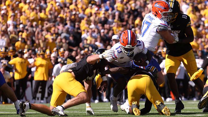 Oct 3, 2026; Columbia, Missouri, USA;  Florida Gators running back Jadan Baugh (13) dives with the ball in the first quarter against the Missouri Tigers at Faurot Field at Memorial Stadium.  Mandatory Credit: William Purnell-Imagn Images