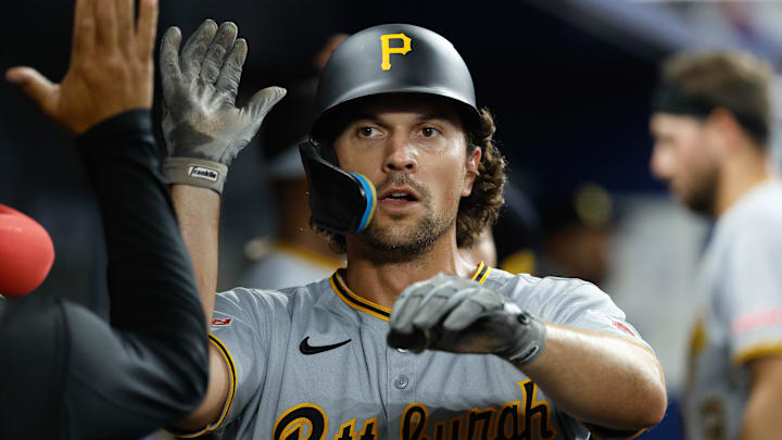 Mar 29, 2025; Miami, Florida, USA; Pittsburgh Pirates second baseman Adam Frazier (26) is congratulated by teammates after scoring against the Miami Marlins during the seventh inning at loanDepot Park. Mandatory Credit: Rhona Wise-Imagn Images Mar 29, 2025; Miami, Florida, USA; Pittsburgh Pirates second baseman Adam Frazier (26) is congratulated by teammates after scoring against the Miami Marlins during the seventh inning at loanDepot Park. Mandatory Credit: Rhona Wise-Imagn Images