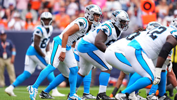 Oct 27, 2024; Denver, Colorado, USA; Carolina Panthers quarterback Bryce Young (9) at the line of scrimmage in the first half against the Denver Broncos at Empower Field at Mile High.