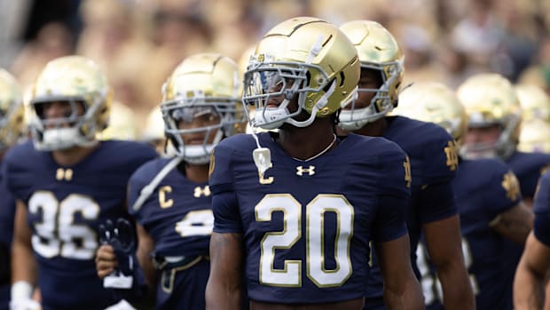 Benjamin Morrison walks with his team during warm ups before a NCAA college football game between Notre Dame
