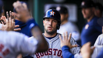 Sep 4, 2024; Cincinnati, Ohio, USA; Houston Astros third baseman Alex Bregman (2) high fives teammates after scoring on a RBI single hit by outfielder Ben Gamel (not pictured) in the second inning against the Cincinnati Reds at Great American Ball Park. Mandatory Credit: Katie Stratman-Imagn Images