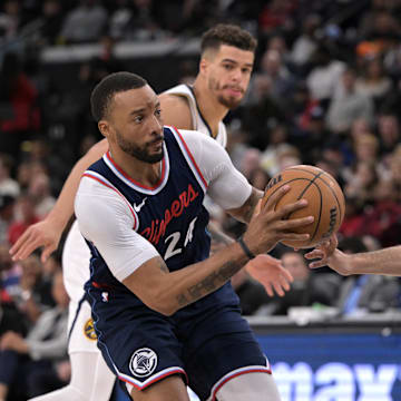 Apr 26, 2025; Inglewood, California, USA; Los Angeles Clippers guard Norman Powell (24) is defended by Denver Nuggets guard Jamal Murray (27) as he drives to the basket in the second half of game four of round one of the 2024 NBA Playoffs at Intuit Dome. Mandatory Credit: Jayne Kamin-Oncea-Imagn Images