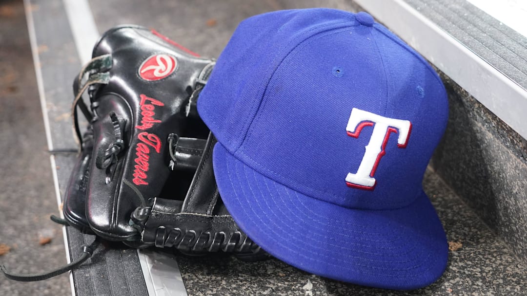 Jul 26, 2024; Toronto, Ontario, CAN; The hat and glove of Texas Rangers fielder Leody Taveras (3) during a game against the Toronto Blue Jays at Rogers Centre. Mandatory Credit: John E. Sokolowski-Imagn Images