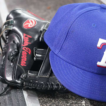 Jul 26, 2024; Toronto, Ontario, CAN; The hat and glove of Texas Rangers fielder Leody Taveras (3) during a game against the Toronto Blue Jays at Rogers Centre. 