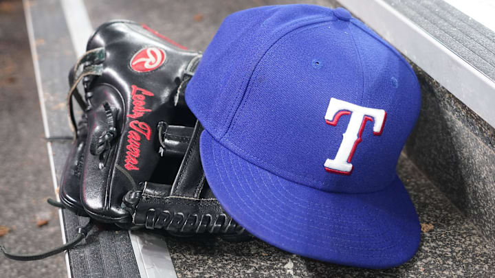 Jul 26, 2024; Toronto, Ontario, CAN; The hat and glove of a Texas Rangers player (3) during a game against the Toronto Blue Jays at Rogers Centre. Jul 26, 2024; Toronto, Ontario, CAN; The hat and glove of a Texas Rangers player (3) during a game against the Toronto Blue Jays at Rogers Centre.