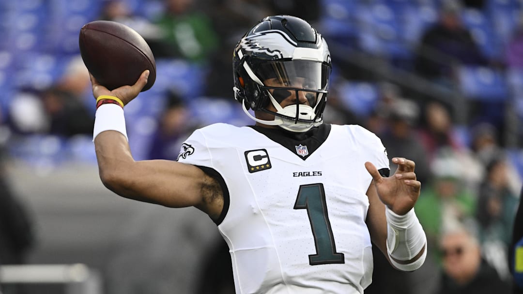Dec 1, 2024; Baltimore, Maryland, USA;  Philadelphia Eagles quarterback Jalen Hurts (1) throws before the game against the Baltimore Ravens at M&T Bank Stadium. Mandatory Credit: Tommy Gilligan-Imagn Images