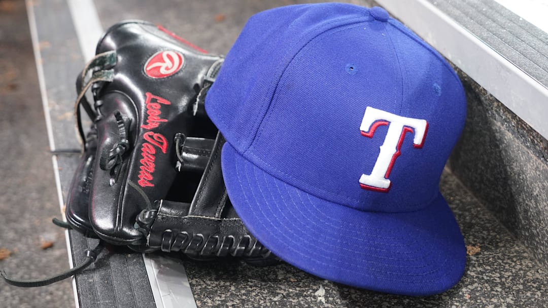 Jul 26, 2024; Toronto, Ontario, CAN; The hat and glove of Texas Rangers fielder Leody Taveras (3) during a game against the Toronto Blue Jays at Rogers Centre. 