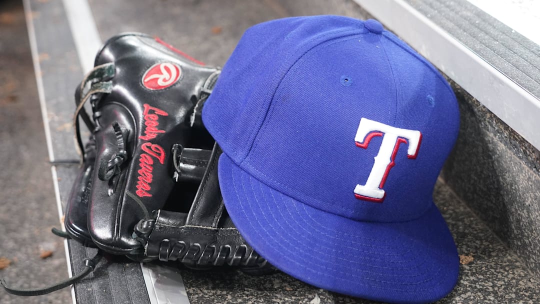 Jul 26, 2024; Toronto, Ontario, CAN; The hat and glove of Texas Rangers fielder Leody Taveras (3) during a game against the Toronto Blue Jays at Rogers Centre. 