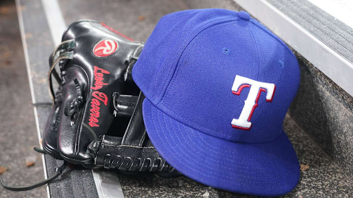 Jul 26, 2024; Toronto, Ontario, CAN; The hat and glove of Texas Rangers fielder Leody Taveras (3) during a game against the Toronto Blue Jays at Rogers Centre. Mandatory Credit: John E. Sokolowski-Imagn Images