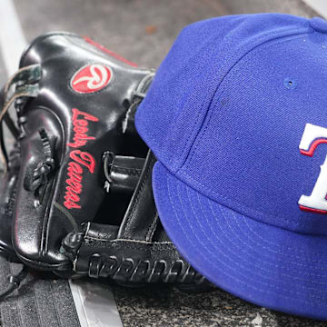 Jul 26, 2024; Toronto, Ontario, CAN; The hat and glove of Texas Rangers fielder Leody Taveras (3) during a game against the Toronto Blue Jays at Rogers Centre.