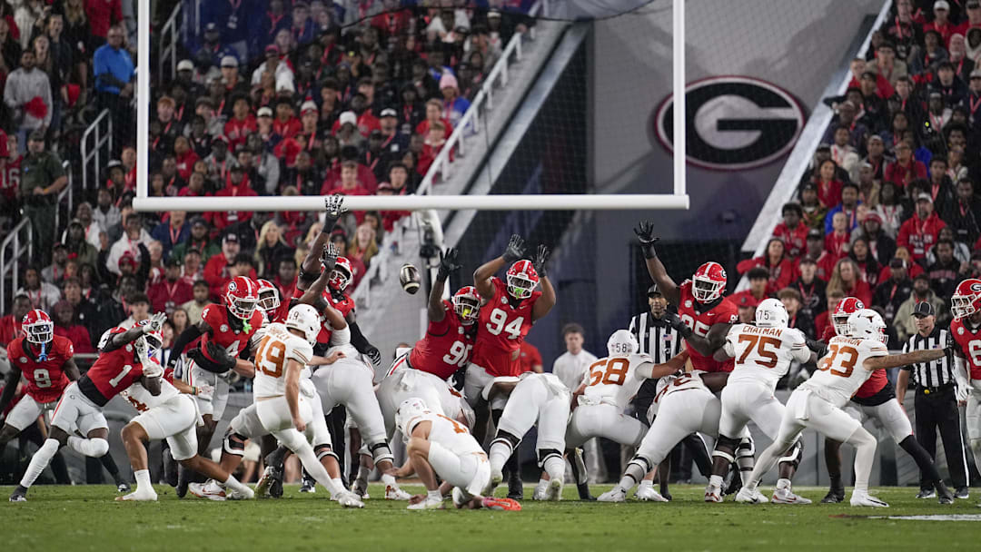 Texas Longhorns kicker Mason Shipley (49) kicks a field goal in the first half against the Georgia Bulldogs  at Sanford Stadium. 