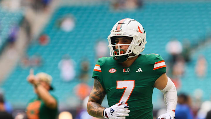 Nov 2, 2024; Miami Gardens, Florida, USA; Miami Hurricanes wide receiver Xavier Restrepo (7) runs on the field before the game against the Duke Blue Devils at Hard Rock Stadium. Mandatory Credit: Sam Navarro-Imagn Images