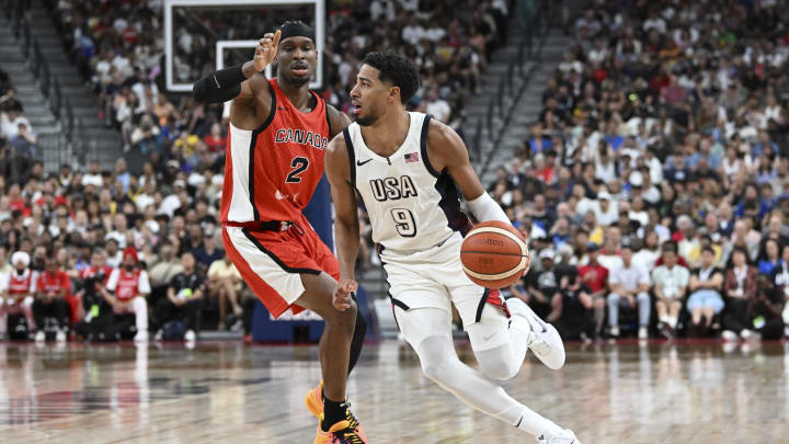 Jul 10, 2024; Las Vegas, Nevada, USA; USA guard Tyrese Haliburton (9) dribbles past Canada guard Shai Gilgeous-Alexander (2) in the second quarter in the USA Basketball Showcase at T-Mobile Arena. Mandatory Credit: Candice Ward-USA TODAY Sports