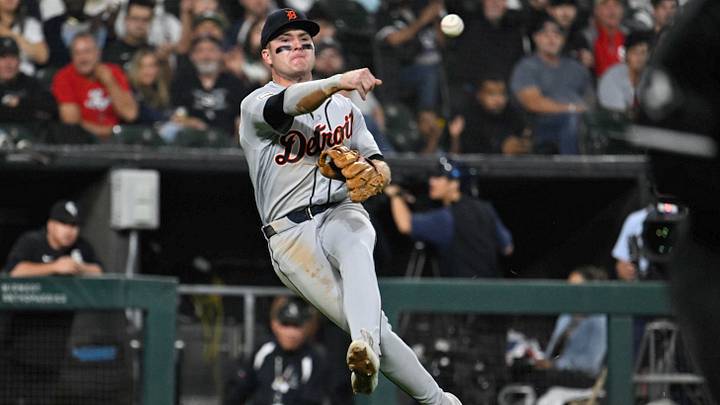 Sep 17, 2026; Chicago, Illinois, USA;  Detroit Tigers shortstop Kevin McGonigle (7) tries to throw out Chicago White Sox center fielder Brenton Doyle (7) at first base during the sixth inning at Rate Field.  Mandatory Credit: Matt Marton-Imagn Images